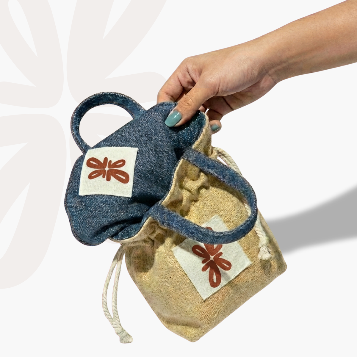 Reversible Sock Pocket in blue denim and beige jute, held in hand, drawstring pouches by Tuelles