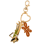 Tuelles Miniformer Keychain, gold-tone mini Pilates reformer keychain with golf club and flower charms