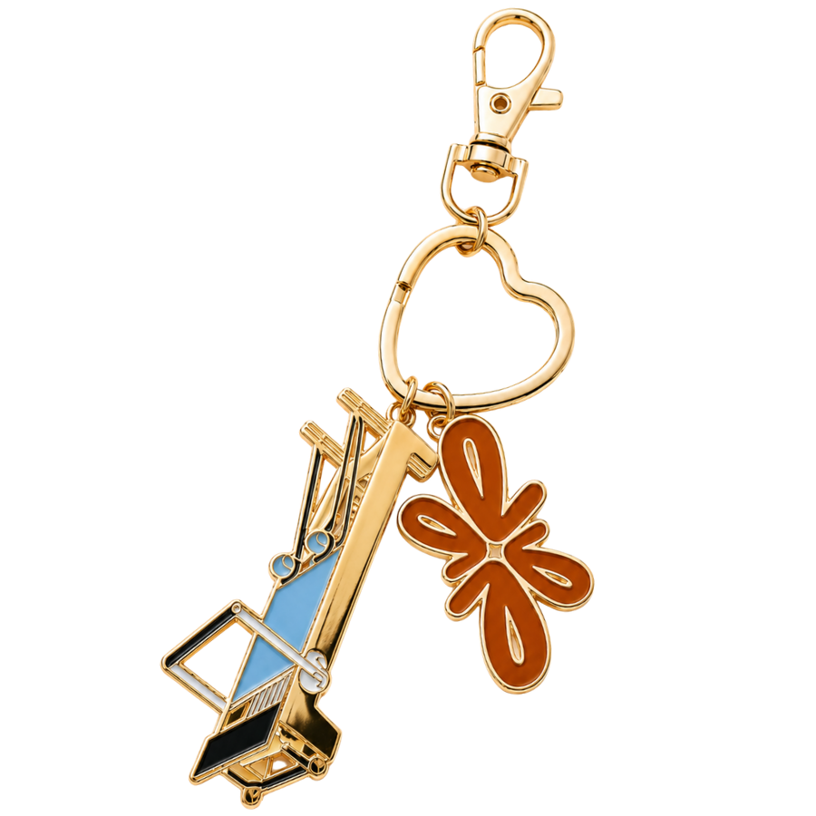 Tuelles Miniformer Keychain, gold-tone mini Pilates reformer keychain with a construction crane charm