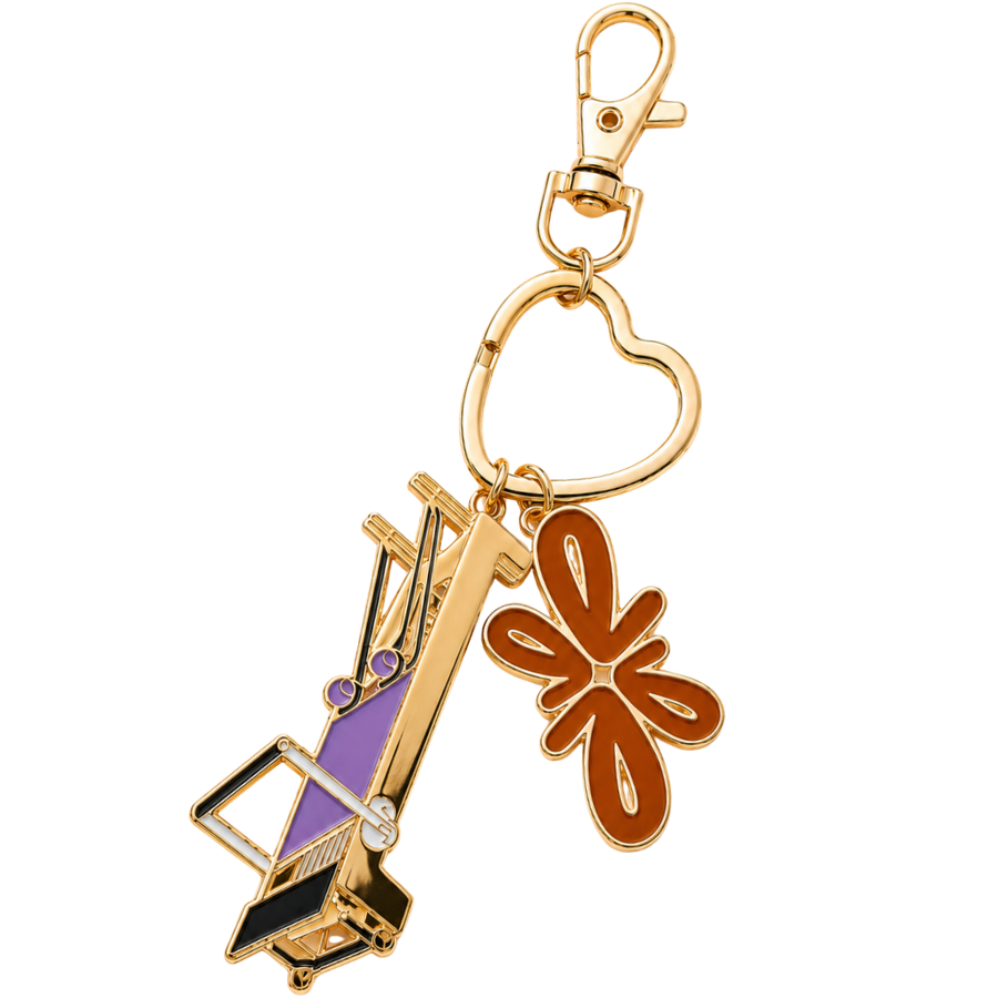 Tuelles Miniformer Keychain, gold-tone mini Pilates reformer keychain with a terracotta flower charm