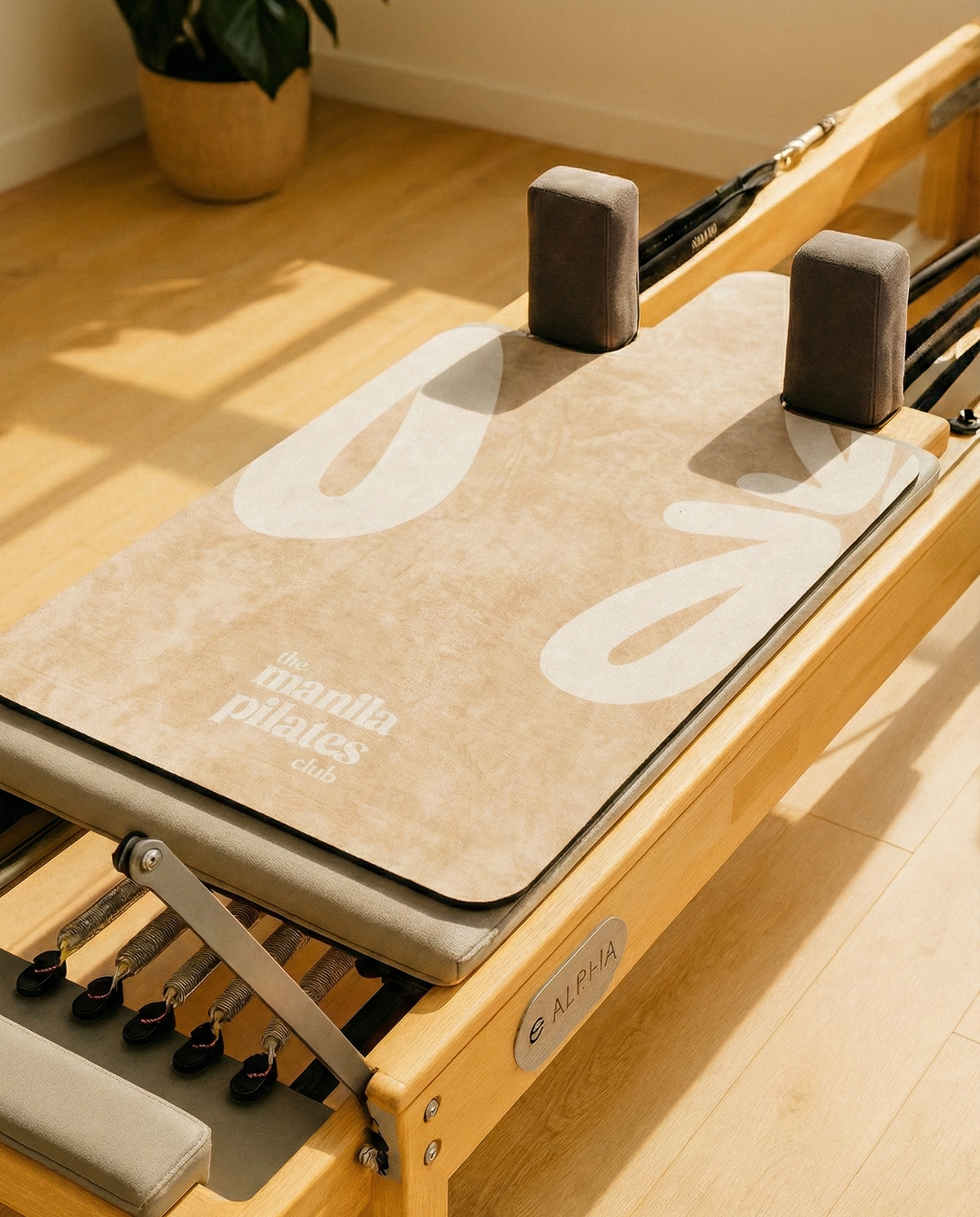 The Classic Reformer Mat in beige on a Pilates reformer, suede Pilates reformer mat by Tuelles