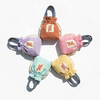 Reversible Sock Pocket in orange-brown, lavender, pink, mint and pale yellow, five drawstring pouches by Tuelles
